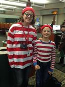Librarian and child in Where's Waldo costumes.